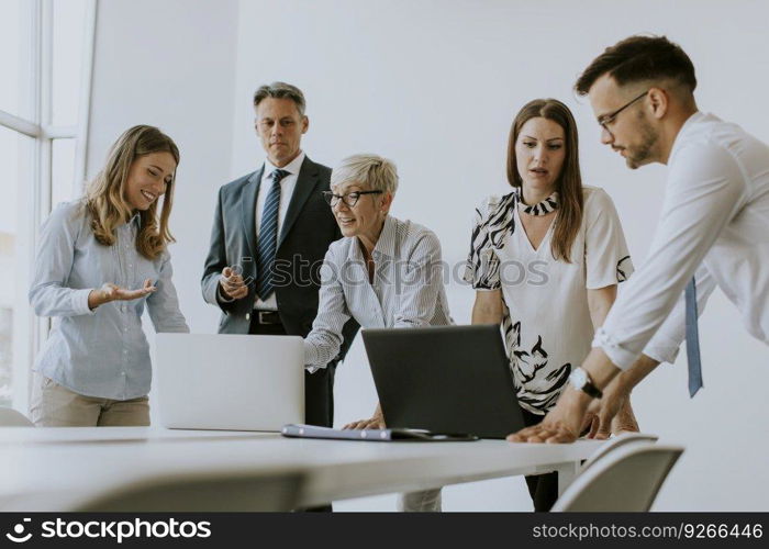 Group of business people working together and preparing new project on a meeting in the office