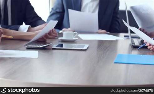 Group of business people working with documents at office