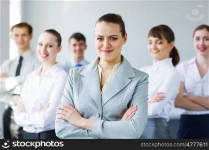 Group of business people. Young business people standing with arms crossed on chest