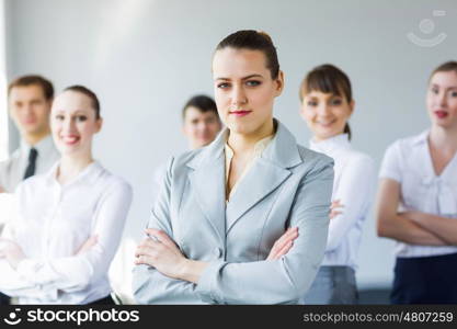 Group of business people. Young business people standing with arms crossed on chest