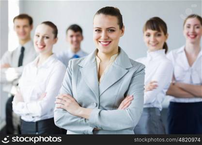 Group of business people. Young business people standing with arms crossed on chest