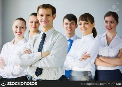 Group of business people. Young business people standing with arms crossed on chest