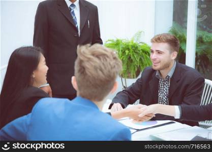 Group of business team people shaking hand with success, agreement of discussion with handshake after meeting in teamwork, communication concept.