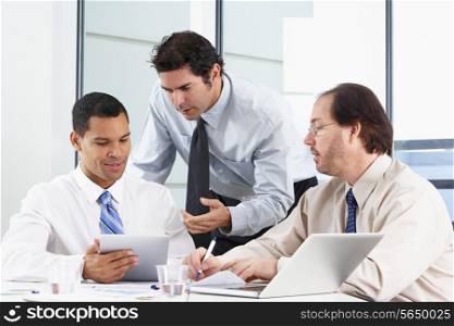 Group Of Businessmen Meeting In Office