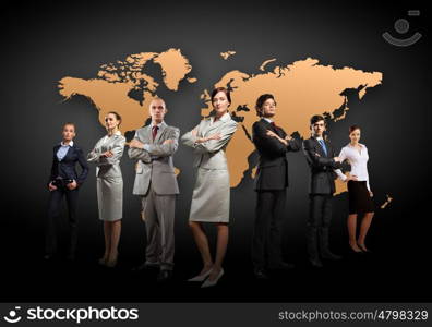 Group of businesspeople. Group of businesspeople standing together against a world map background