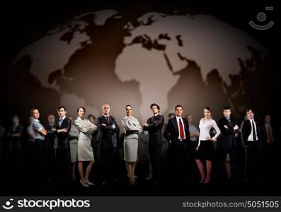 Group of businesspeople. Group of businesspeople standing together against a world map background