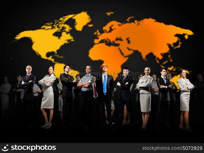 Group of businesspeople. Group of businesspeople standing together against a world map background