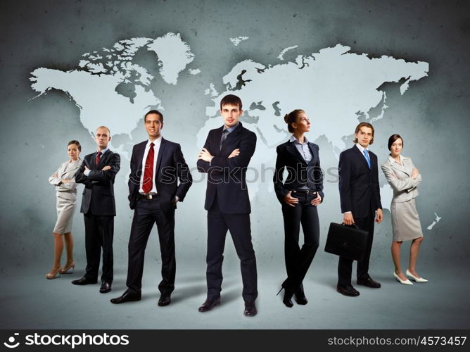 Group of businesspeople. Image of businesspeople standing against world map background