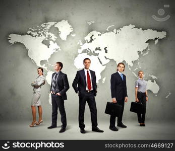 Group of businesspeople. Image of businesspeople standing against world map background