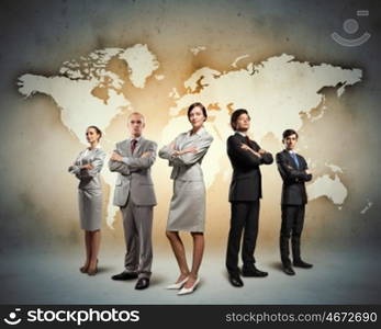 Group of businesspeople. Image of businesspeople standing against world map background