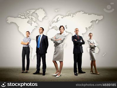 Group of businesspeople. Image of businesspeople standing against world map background