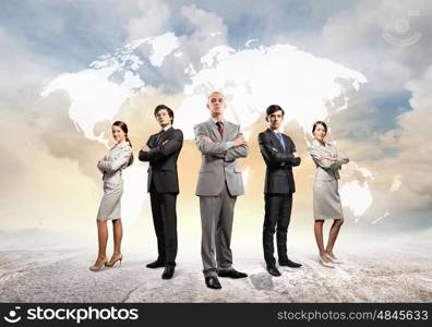 Group of businesspeople. Image of businesspeople standing against world map background