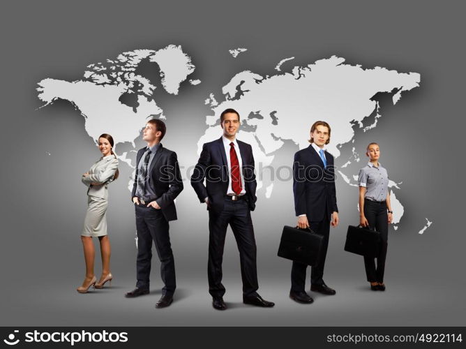 Group of businesspeople. Image of businesspeople standing against world map background