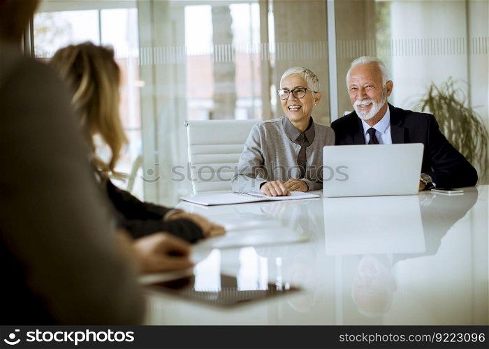 Group of businesspeople in conference room during a meeting in office