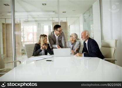 Group of businesspeople in conference room during a meeting in office
