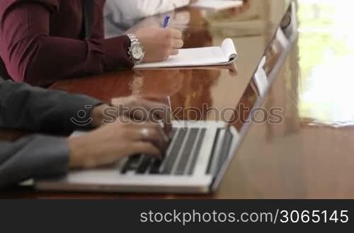 Group of businesspeople meeting in conference room. Rack focus