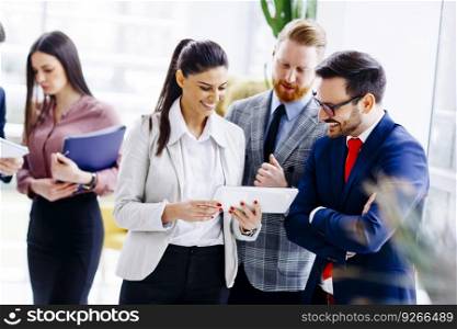 Group of businesspeople standing in the modern office