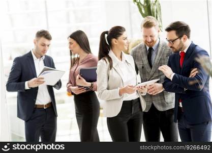 Group of businesspeople standing in the modern office