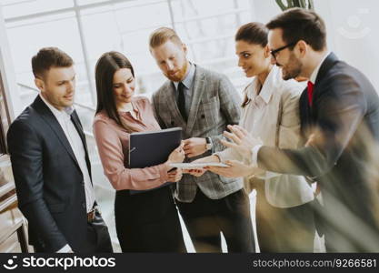 Group of businesspeople standing in the modern office