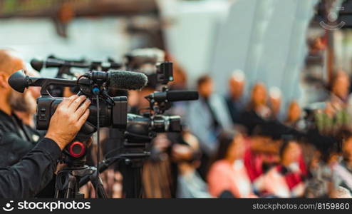 Group of Cameras at an Indoor Event