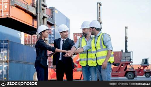 Group of cargo container workers or factory and engineer technicians show hand coordination together in workplace area. Concept of good teamwork support best success work of industrial business.