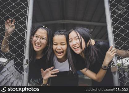 group of cheerful asian teenager happiness emotion in school sport gymnaseum