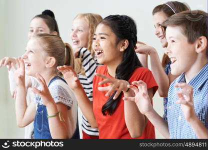 Group Of Children Enjoying Drama Club Together