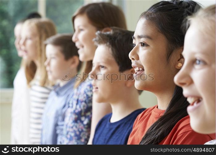 Group Of Children Enjoying Singing Group