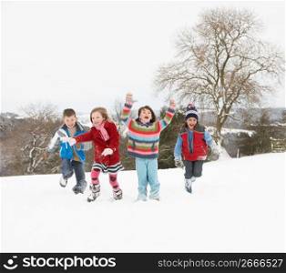 Group Of Children Having Fun In Snowy Countryside