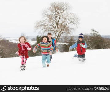 Group Of Children Having Fun In Snowy Countryside