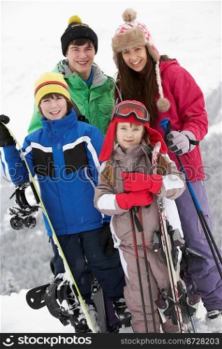 Group Of Children On Ski Holiday In Mountains