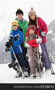 Group Of Children On Ski Holiday In Mountains