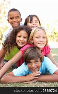 Group Of Children Piled Up In Park