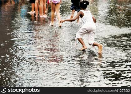 Group of children playing in water