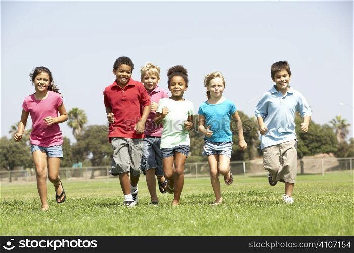 Group Of Children Running In Park