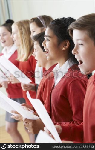 Group Of Children Singing In School Choir