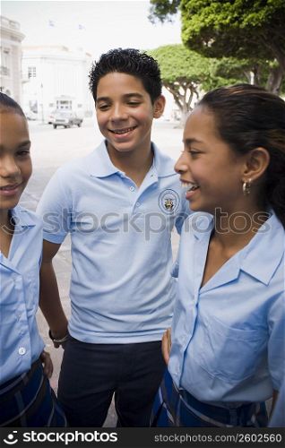 Group of children wearing school uniform socializing