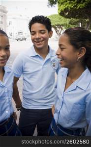 Group of children wearing school uniform socializing