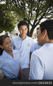 Group of children wearing school uniform talking