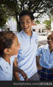 Group of children wearing school uniform talking