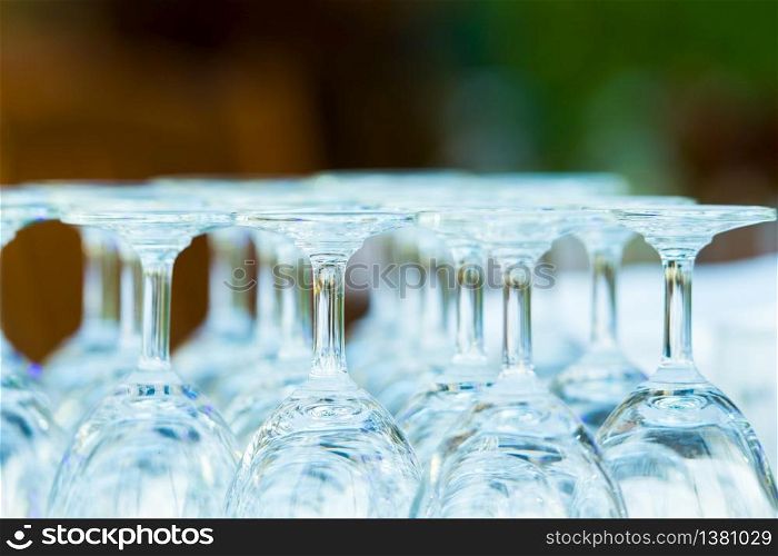 group of clear bottom wine glass arrangement on table bar.