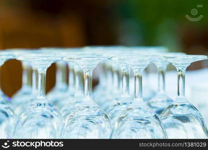group of clear bottom wine glass arrangement on table bar.