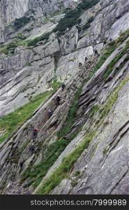 Group of climbers on the rock near Andermatt in Switzerland