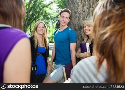 Group of college students relaxing outdoors