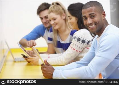 Group Of College Students Using Digital Devices