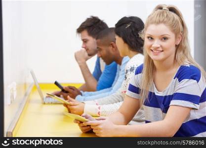 Group Of College Students Using Digital Devices