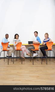 Group Of College Students Working At Desk Together