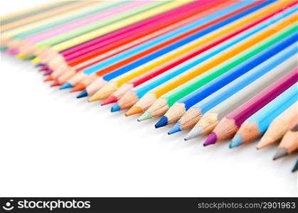 Group of color pencils over white