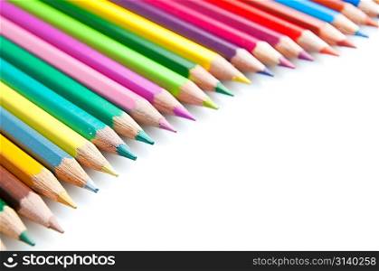 Group of color pencils over white