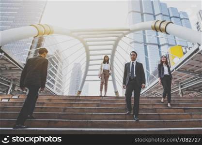 group of confident businessman going down and walking on stairs, vintage theme